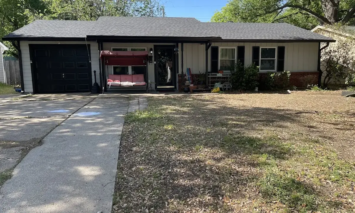 Asphalt Shingle Roof Repair crew at work on a residential roof in Alvin